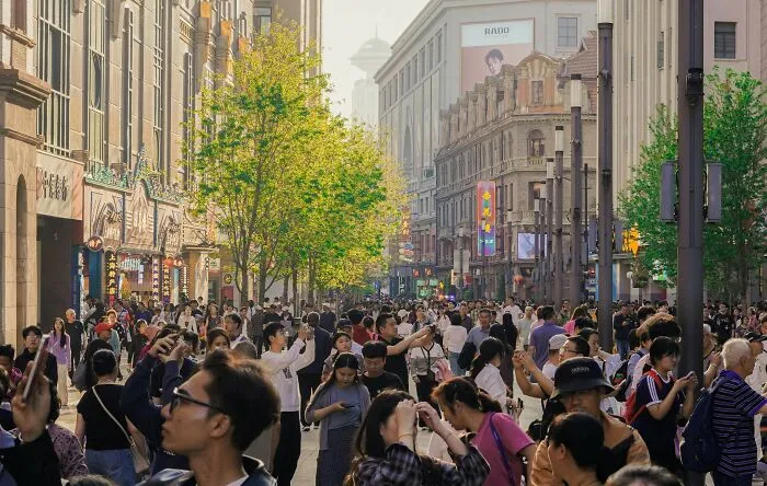 A crowded city street filled with pedestrians, illustrating real laws in public spaces.