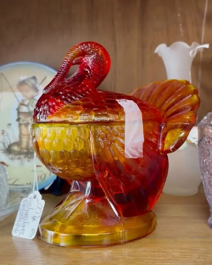 A vintage amber glass turkey candy dish displayed as a unique thrift find.