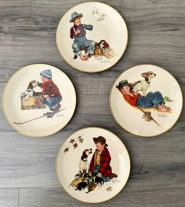 Four vintage decorative plates featuring illustrations of boys and dogs, unique thrift finds