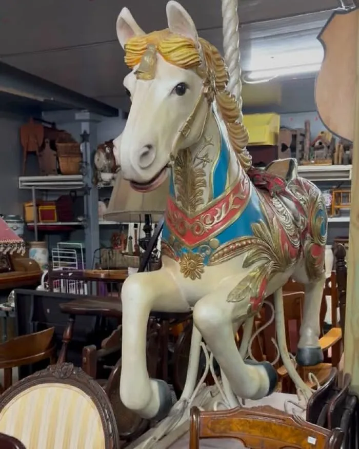 Vintage carousel horse sculpture discovered as a unique thrift find in an antique shop.