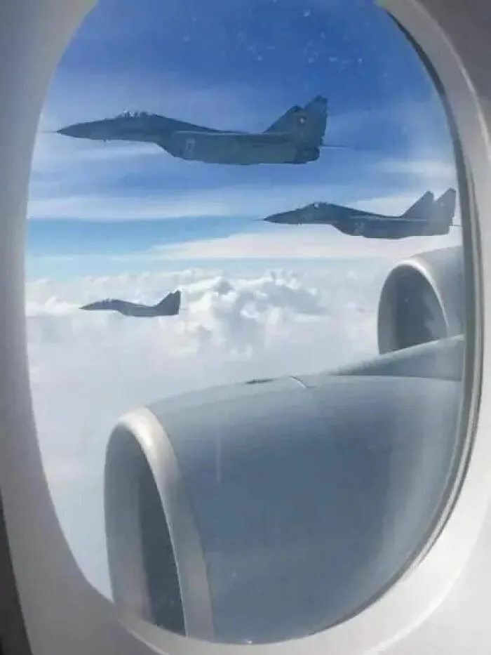 Cursed images of military fighter jets seen through an airplane window
