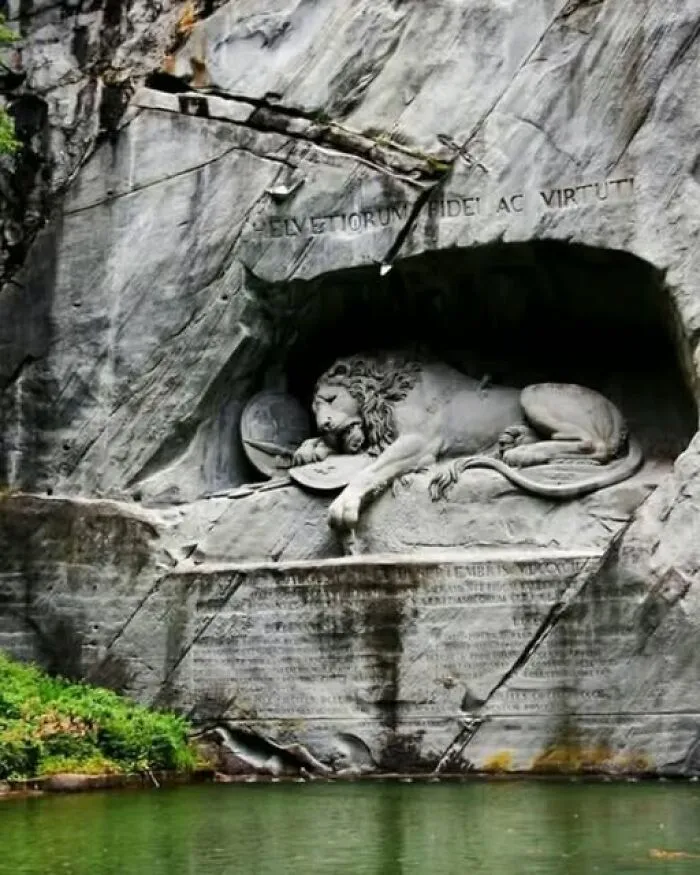 Famous Lion Monument carved into a rock cliff face, an example of interesting photos.