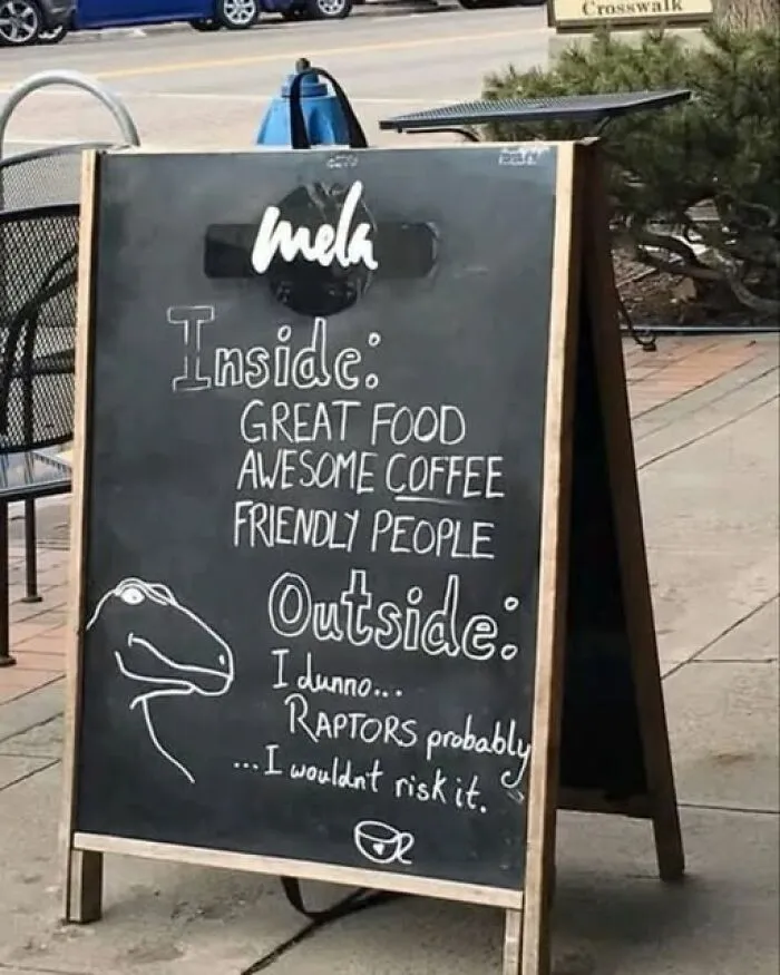 Funny sidewalk chalkboard sign from interesting photos collection warning about raptors outside
