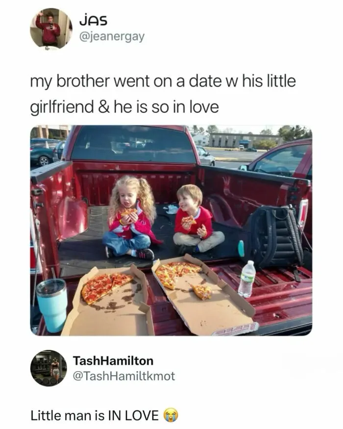 Two young kids sharing pizza on a truck bed, shared as wholesome moments from around the world.