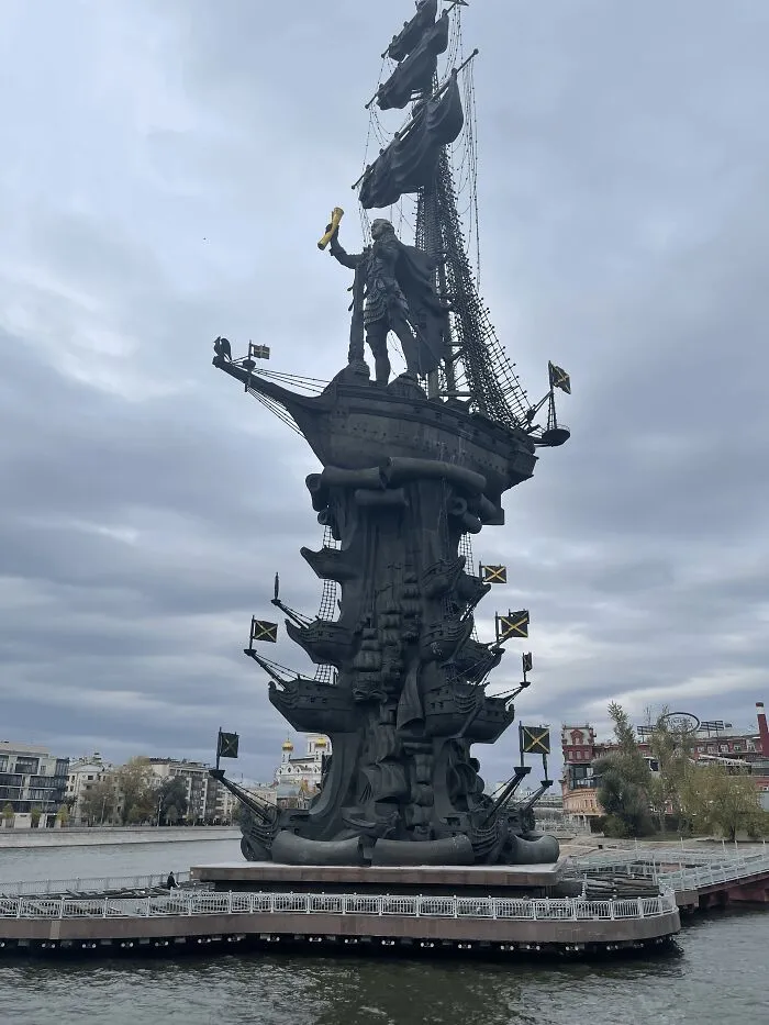 An imposing, dark Peter the Great monument on water, a grand yet controversial public art installation.