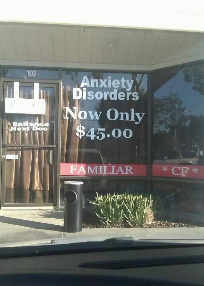 Storefront window reading Anxiety Disorders Now Only $45.00, an ironic advertising fail.