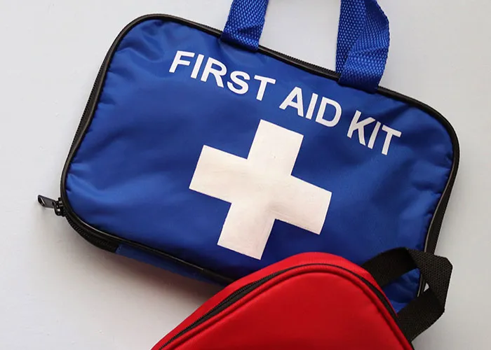 Blue first aid kit essential safety gear for haunted house workers