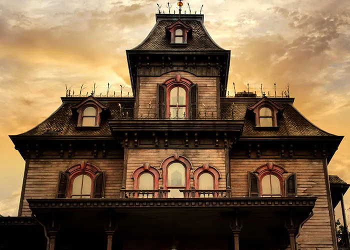 Creepy old haunted house with ominous sky during spooky event