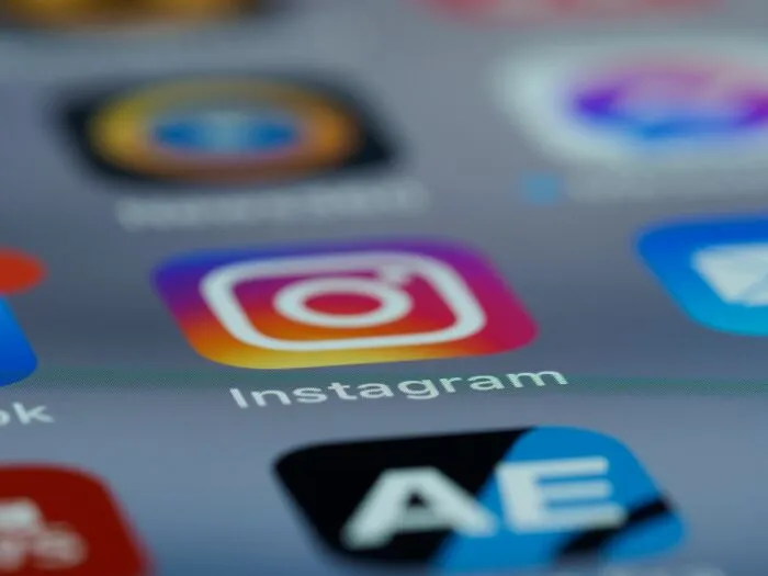 Close-up of Instagram app icon on smartphone screen