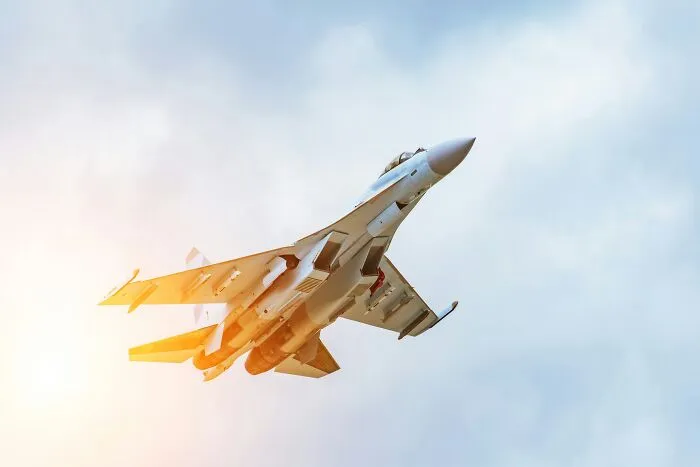 Fighter jet flying high in the sky reminding how quickly everything can fall apart with one wrong move