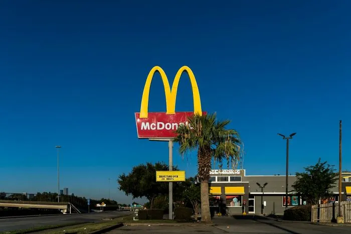McDonalds sign and building under clear blue sky