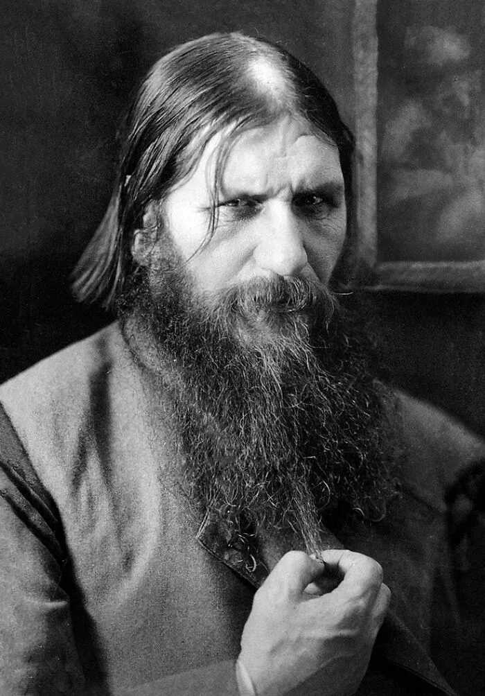Portrait of a historical figure with a long beard and intense expression