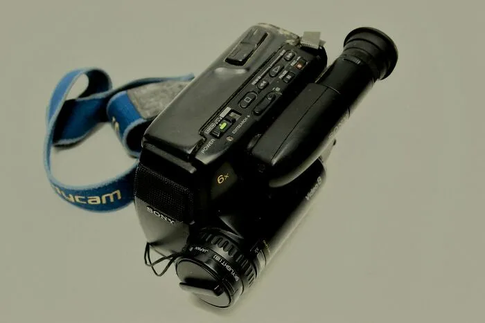 Old Sony camcorder lying on a plain surface