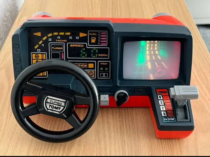 A classic vintage Tomy Turbo steering wheel handheld game, one of the nostalgic photos of 80s kids toys.