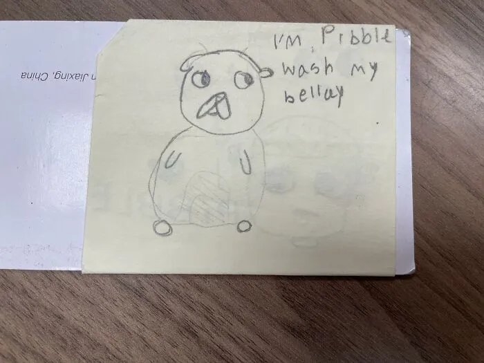 A hand-drawn sketch of a creature with funny text on a sticky note, an example of lost and forgotten messages