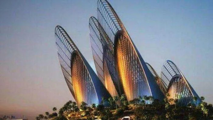 Strange building with multiple curved glass towers at sunset