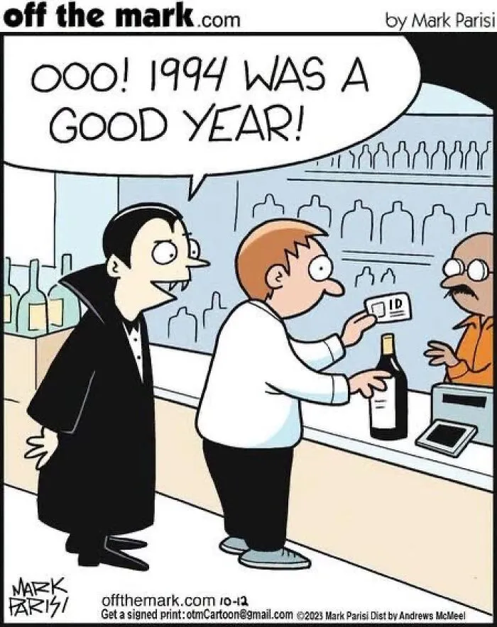 Halloween comics image of a vampire checking a customer ID year at a liquor store counter.