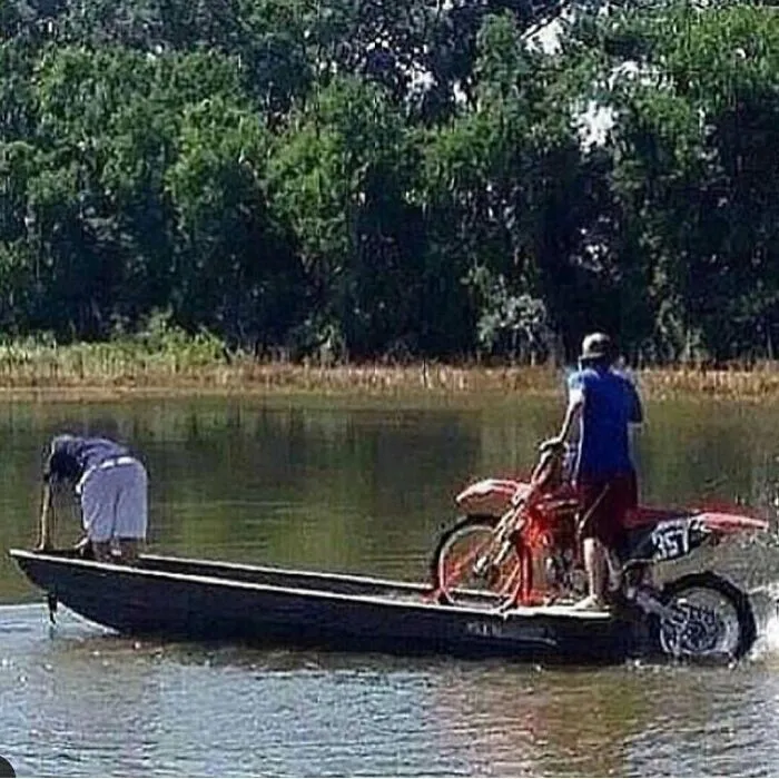 Hilarious redneck memes showing a dirt bike motor powering a small boat across the water with two men.