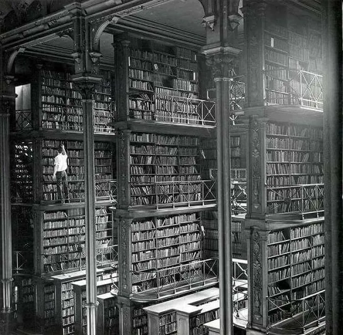 A Man Browsing For Books In Cincinnati's Cavernous Old Main Library. The Library Was Demolished In 1955