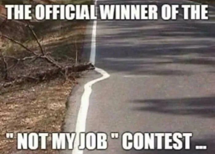 A rednecks meme displaying a painted road line curving around a fallen tree branch.
