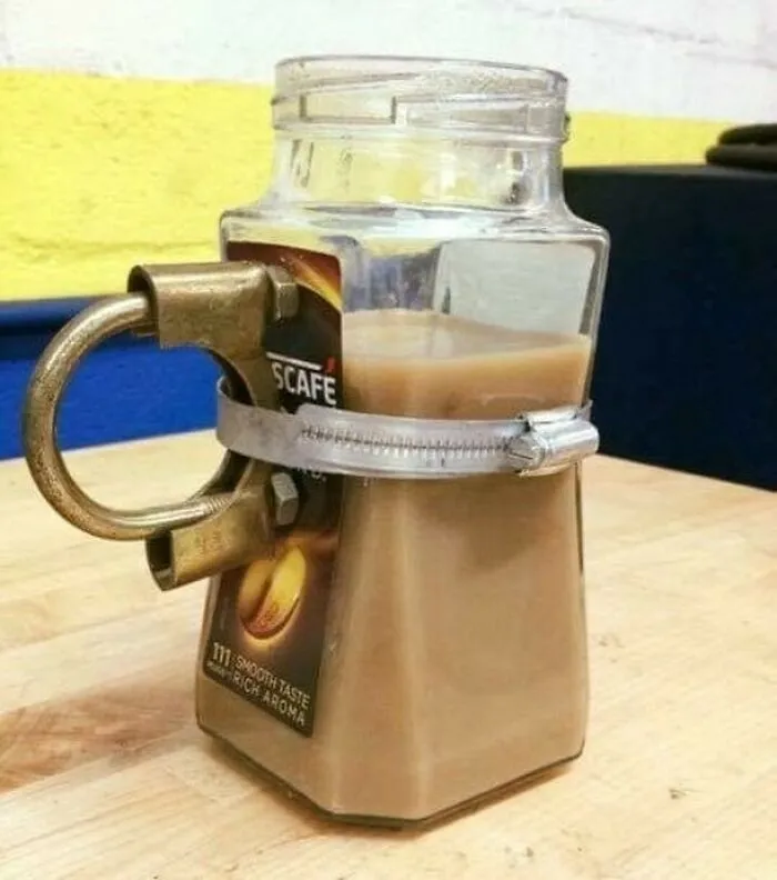 Slavic engineering style coffee jar mug made with a metal pipe clamp handle