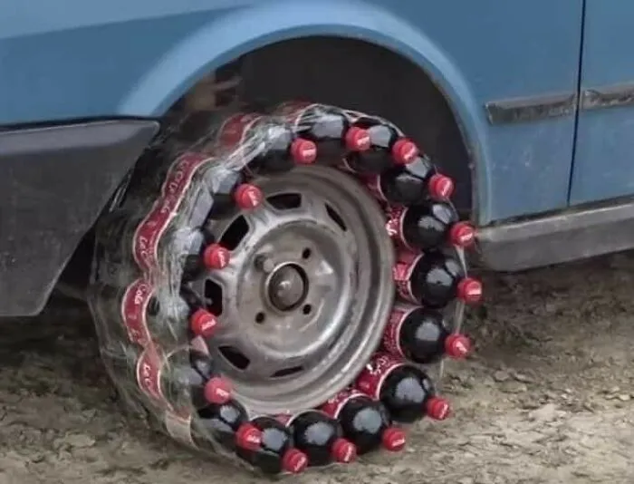 Car wheel made out of plastic soda bottles wrapped around the rim, showing bizarre DIY Slavic engineering.