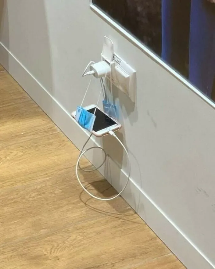 Slavic engineering solution using face masks as a wall charging phone holder
