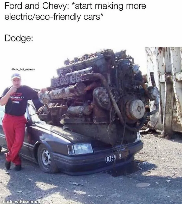 An oversized car engine crushing a small vehicle featured in redneck memes about auto modifications.