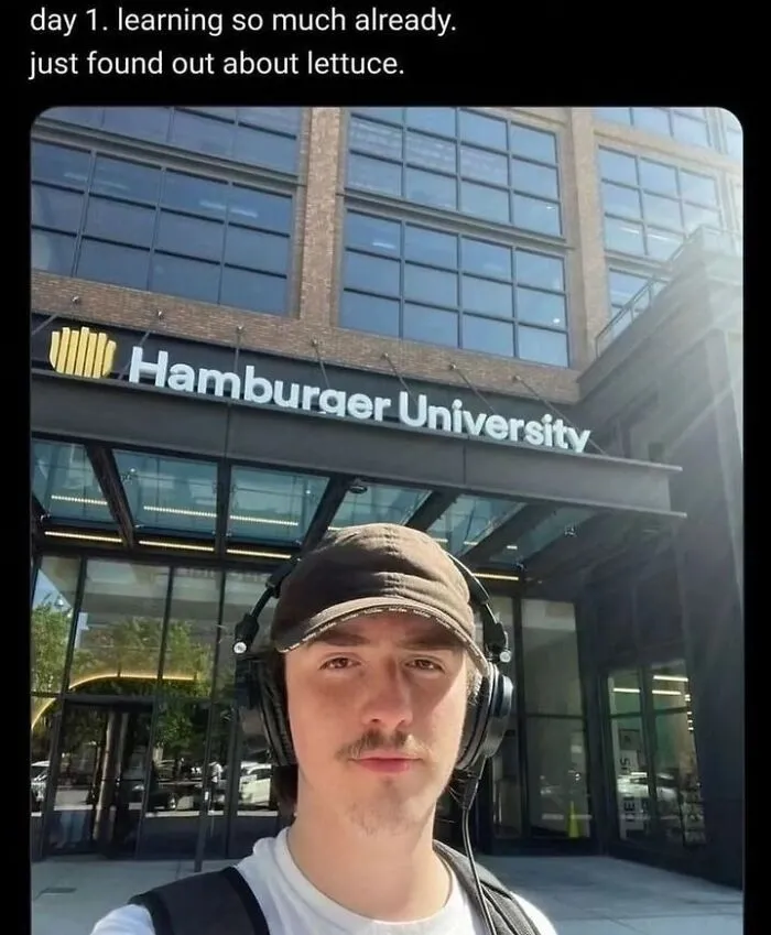 A selfie of a young man in front of Hamburger University featured in absurd internet posts.