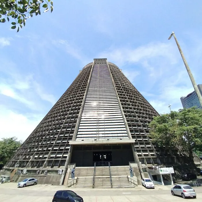 Monumental pyramid-like buildings with bizarre shapes featuring a steep central staircase