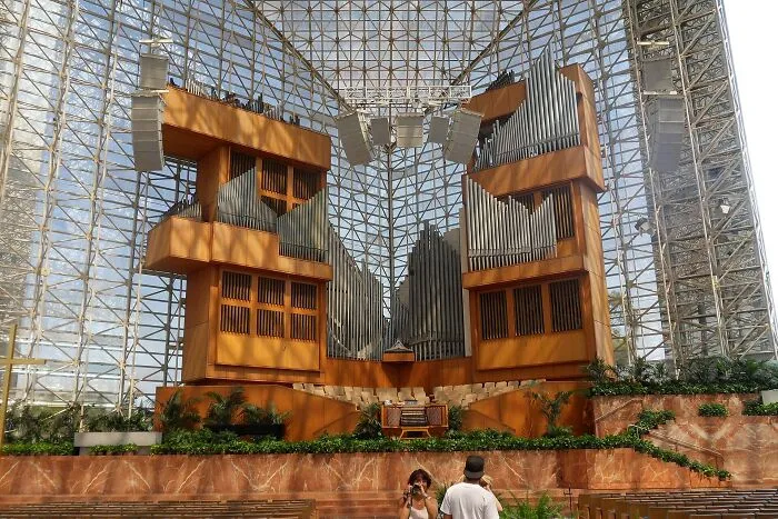 An indoor organ and structural design displaying bizarre architecture.