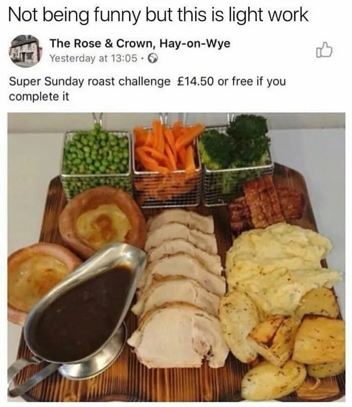 British Sunday roast challenge at a pub featuring meat, vegetables, and gravy on a board