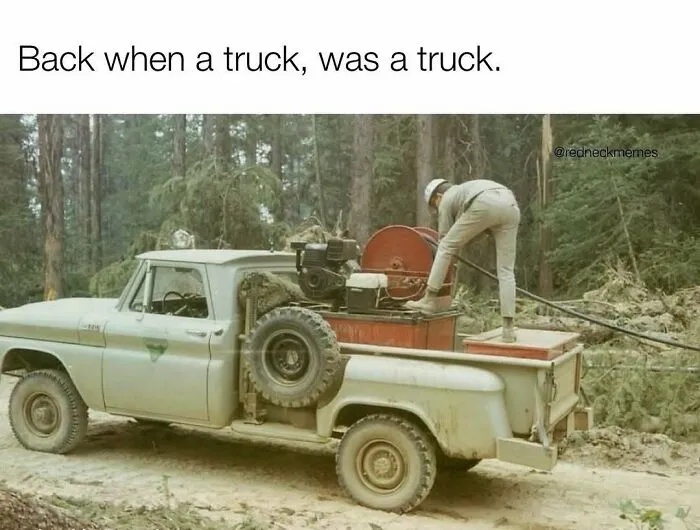 A vintage pickup truck loaded with equipment in the woods as part of redneck memes.