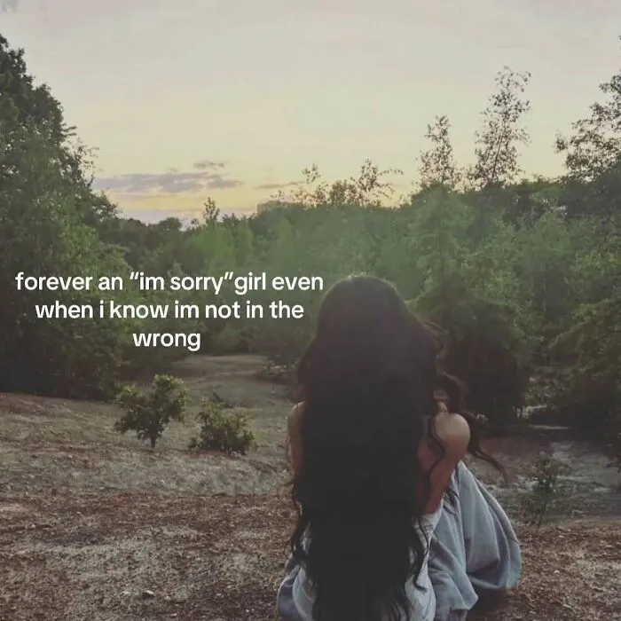A girl with long hair looking at a forest representing memes about minor inconveniences.