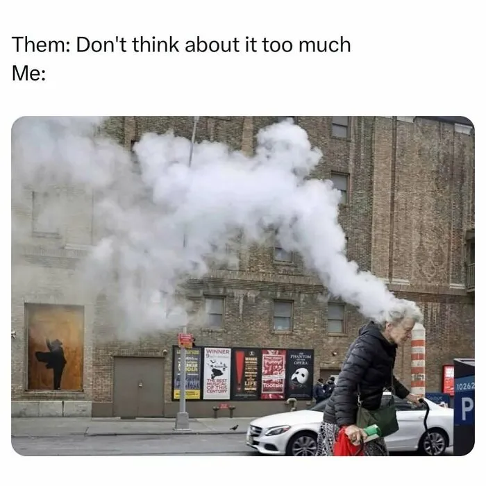 Humorous image of a person with smoke coming from their head illustrating overthinking meme