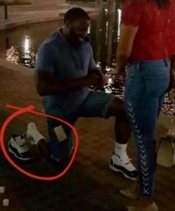 Hilarious pics of a man proposing while carefully hovering his knee to protect his sneaker.