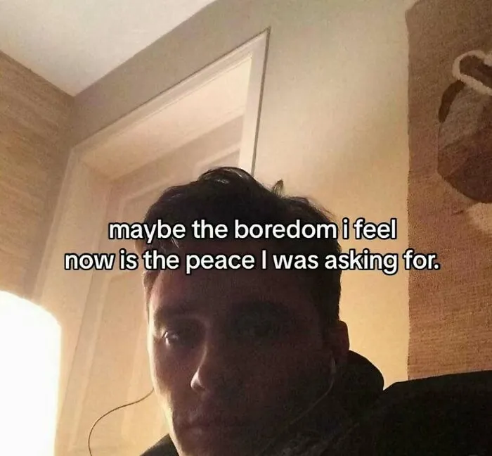 A contemplative meme featuring a man with text about finding peace in boredom