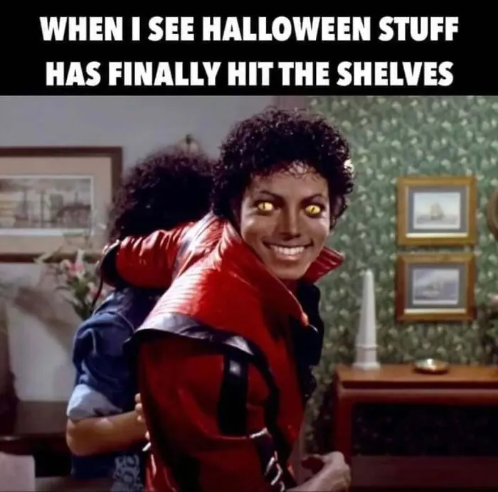 Michael Jackson with yellow werewolf eyes smiling for Halloween memes about store decorations hitting shelves.