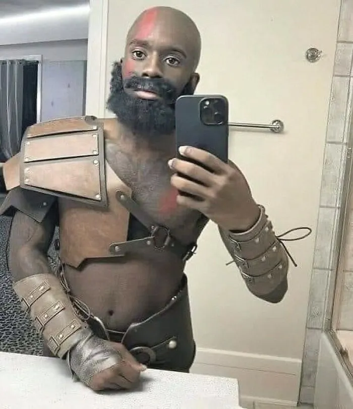 A man taking a mirror selfie while cosplaying as Kratos, one of many amusing posts