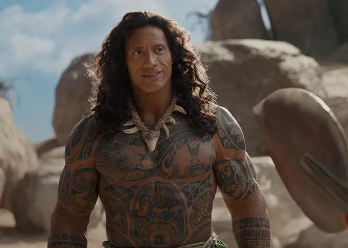 Dwayne Johnson as one of the Hollywood stars with tribal tattoos standing outdoors in a movie scene.