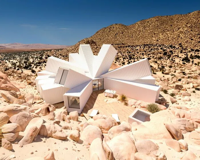 Modern strange building in desert with white angular geometric structures