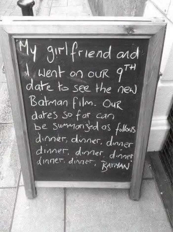 A funny sign with text about date night in a collection of wholesome memes.