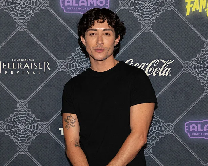 Actor Leo Sheng posing in a black t-shirt, representing trans actors in Hollywood.