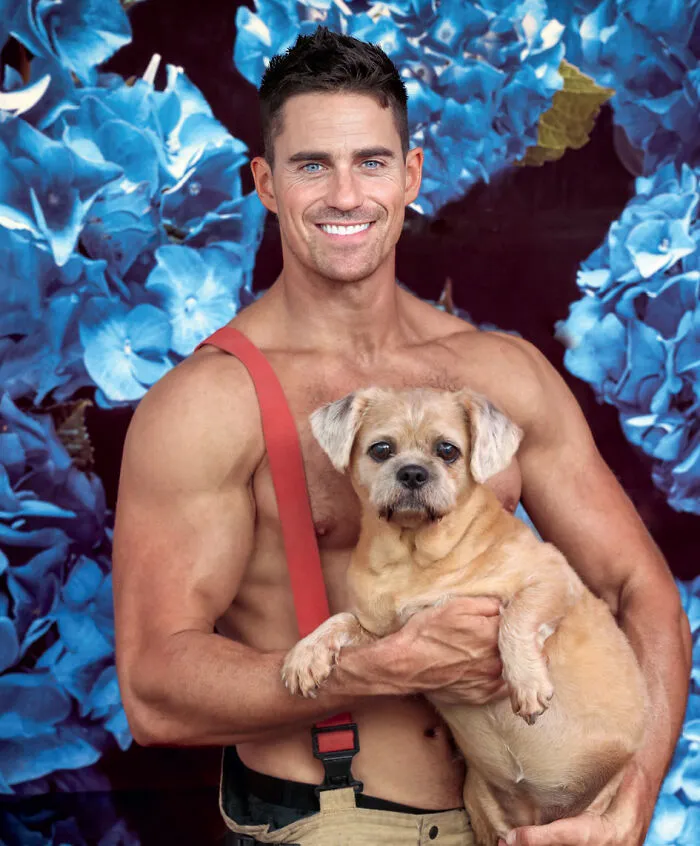 2027 Australian firefighters calendar muscular man holding dog with flowers background