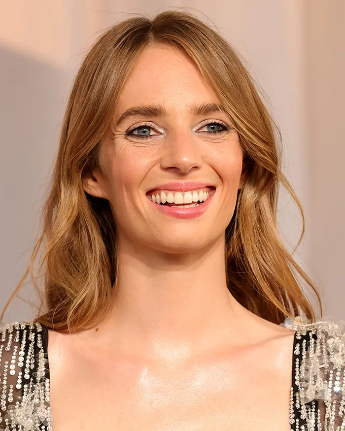 Unedited photos of Maya Hawke showing off her smile at the Academy Museum Gala.