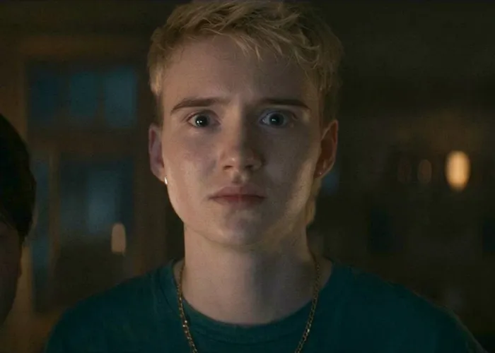 Trans actor with blonde hair speaking during an interview, representing trans actors in Hollywood