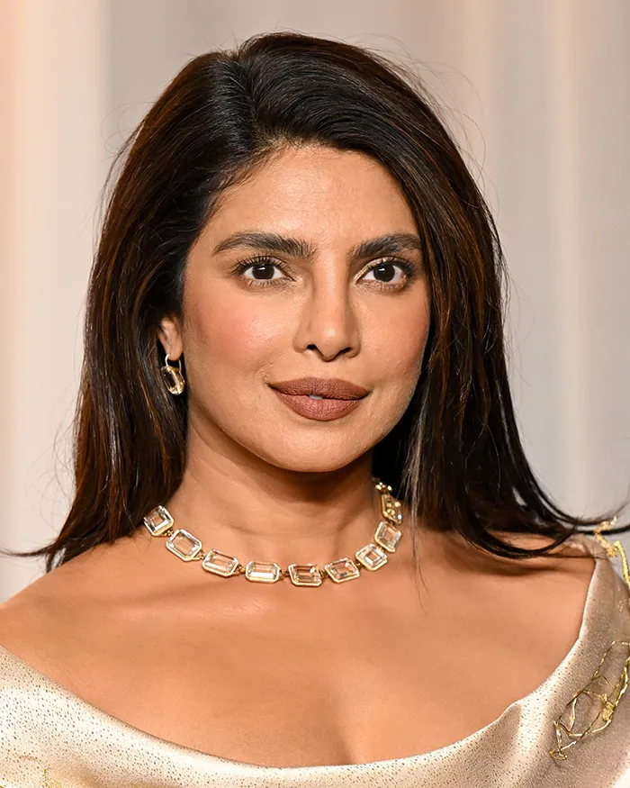 Close-up unedited photo of a star with long dark hair at the Academy Museum Gala.