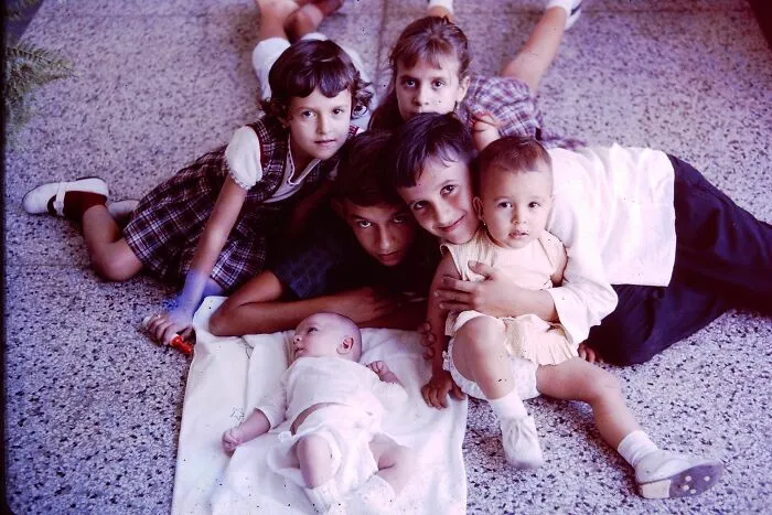 Group of kids laying on the floor sharing secrets