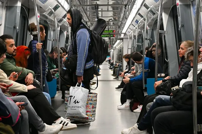 Commuters on a subway train where strangers said something unsettling, activating someone's fight or flight.