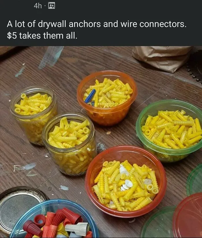 Small plastic containers filled with yellow anchors and wire connectors in a confusing photo perspective.